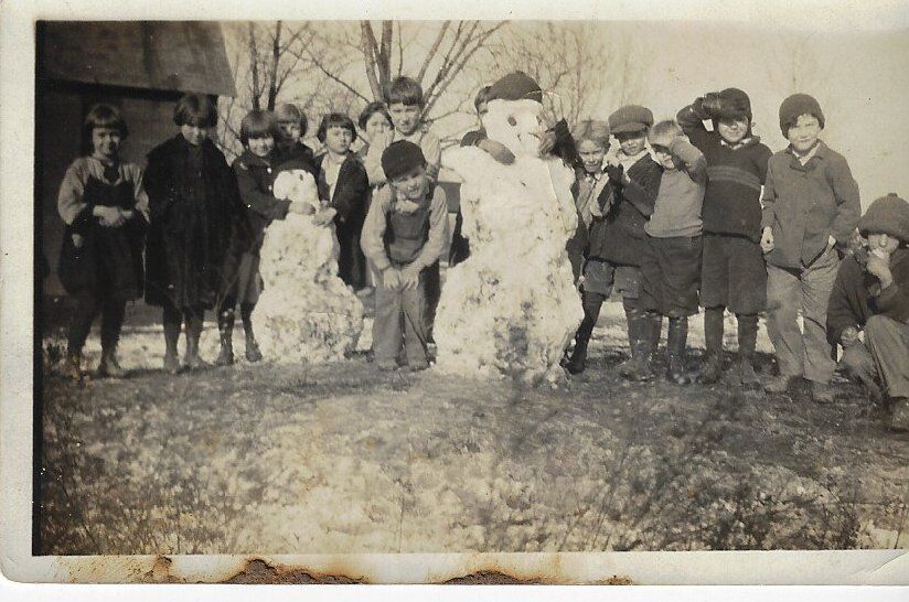 Looking Back: Students building a snowman